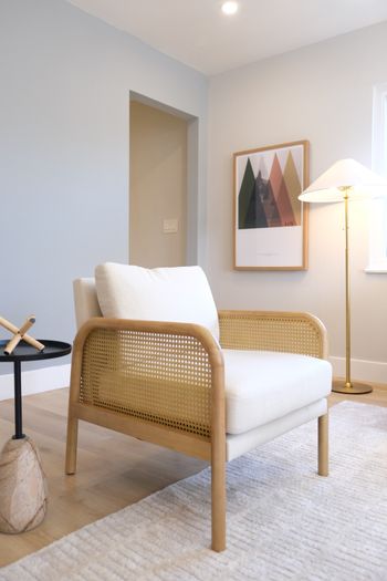 Deep seated cane chair with woven sides